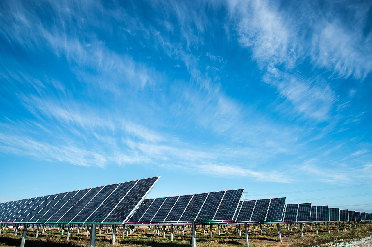 Rows of solar panels and blue sky